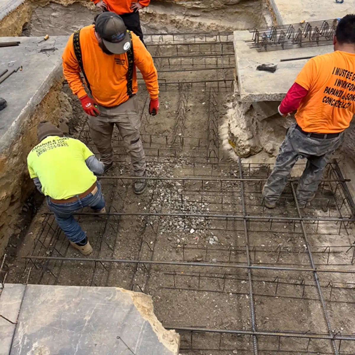 Steel rebar grid tied in place before an interior concrete floor pour in Cherry Hill, NJ