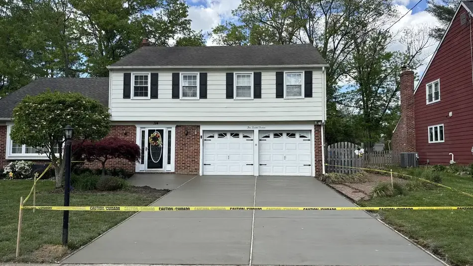Finished concrete driveway at a two story colonial home in Cherry Hill, New Jersey