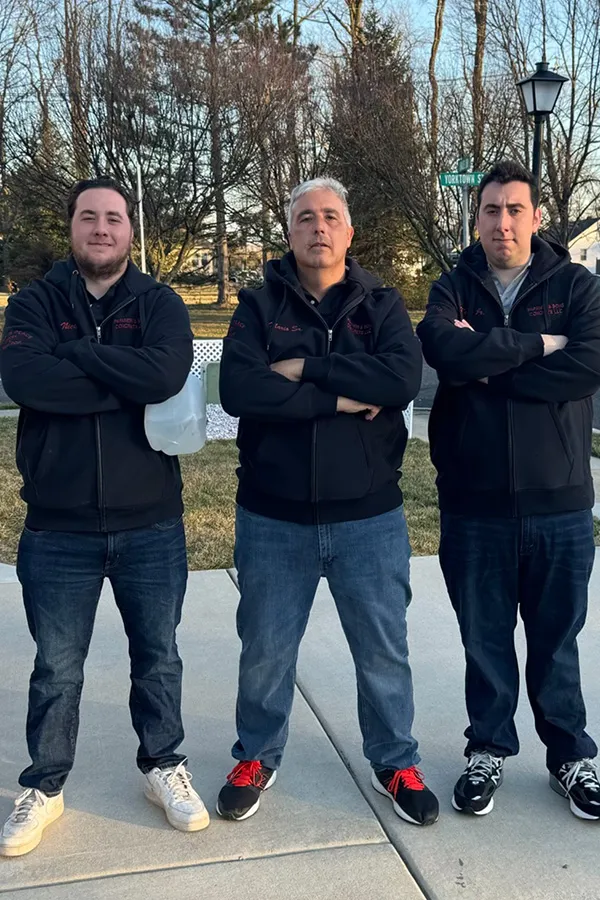 Three members of the Papaneri & Sons concrete team standing on a sidewalk, the crew serving Gibbsboro, NJ