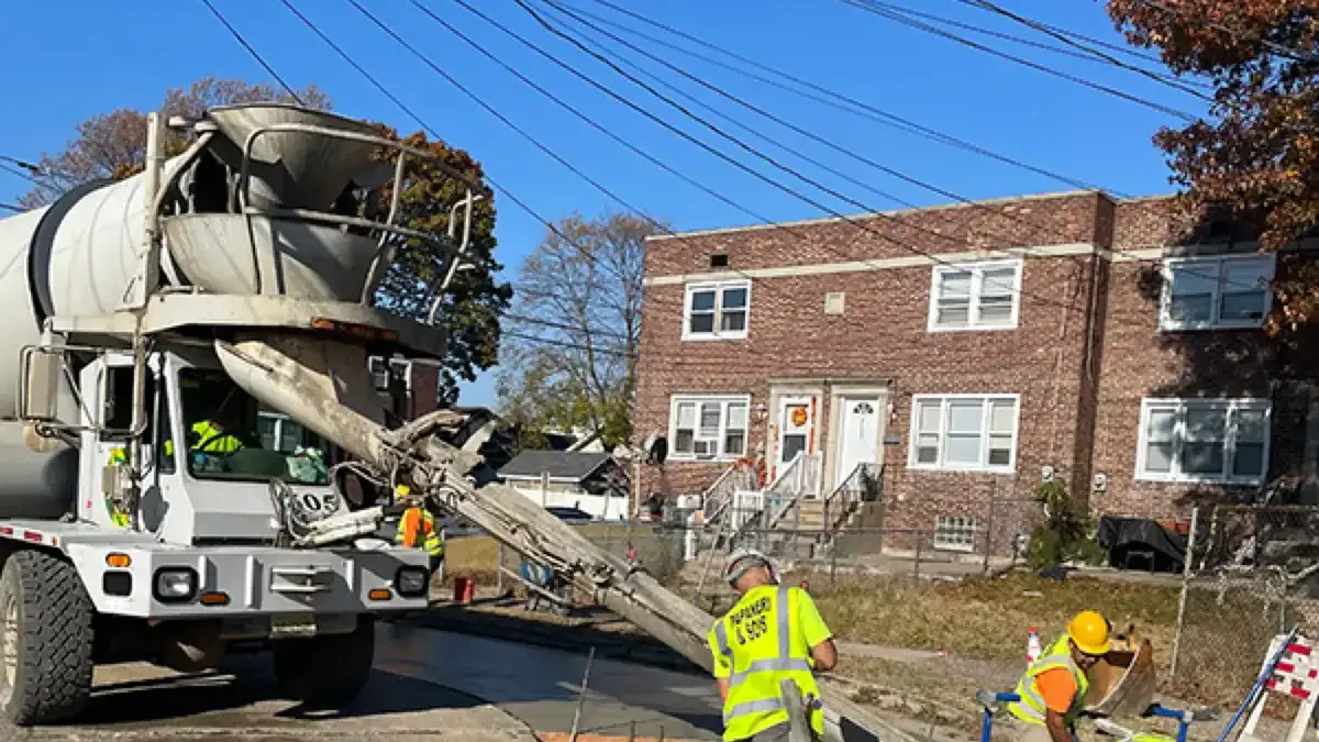 Ready-mix truck discharging concrete down the chute on a Cherry Hill NJ job