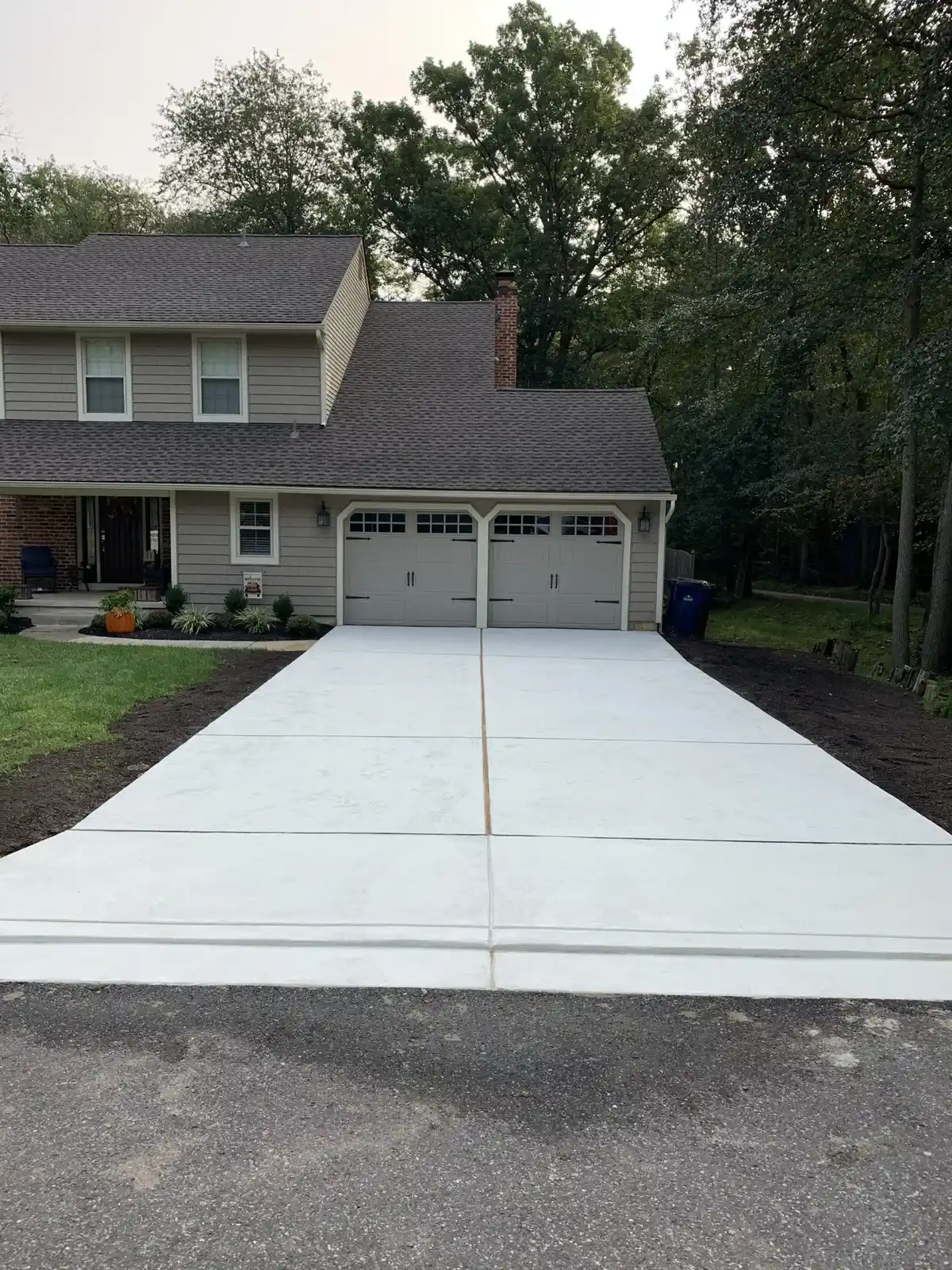 Control joints spaced across a wide concrete driveway in Cherry Hill, NJ