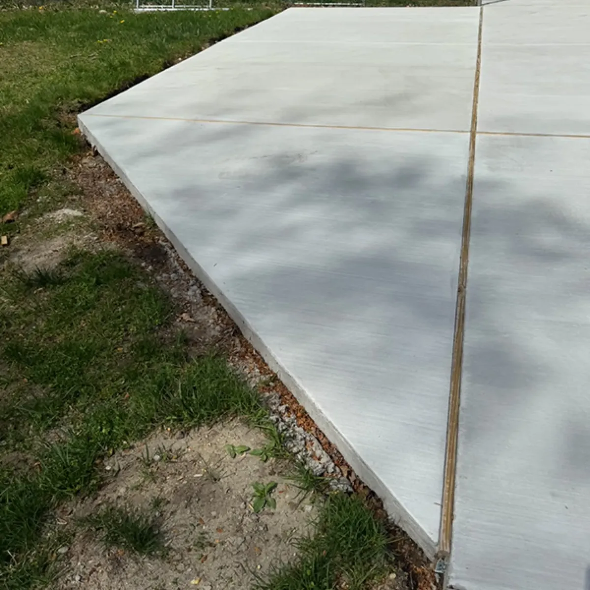 Close-up of a straight joint line cut into a finished concrete slab in Cherry Hill, NJ
