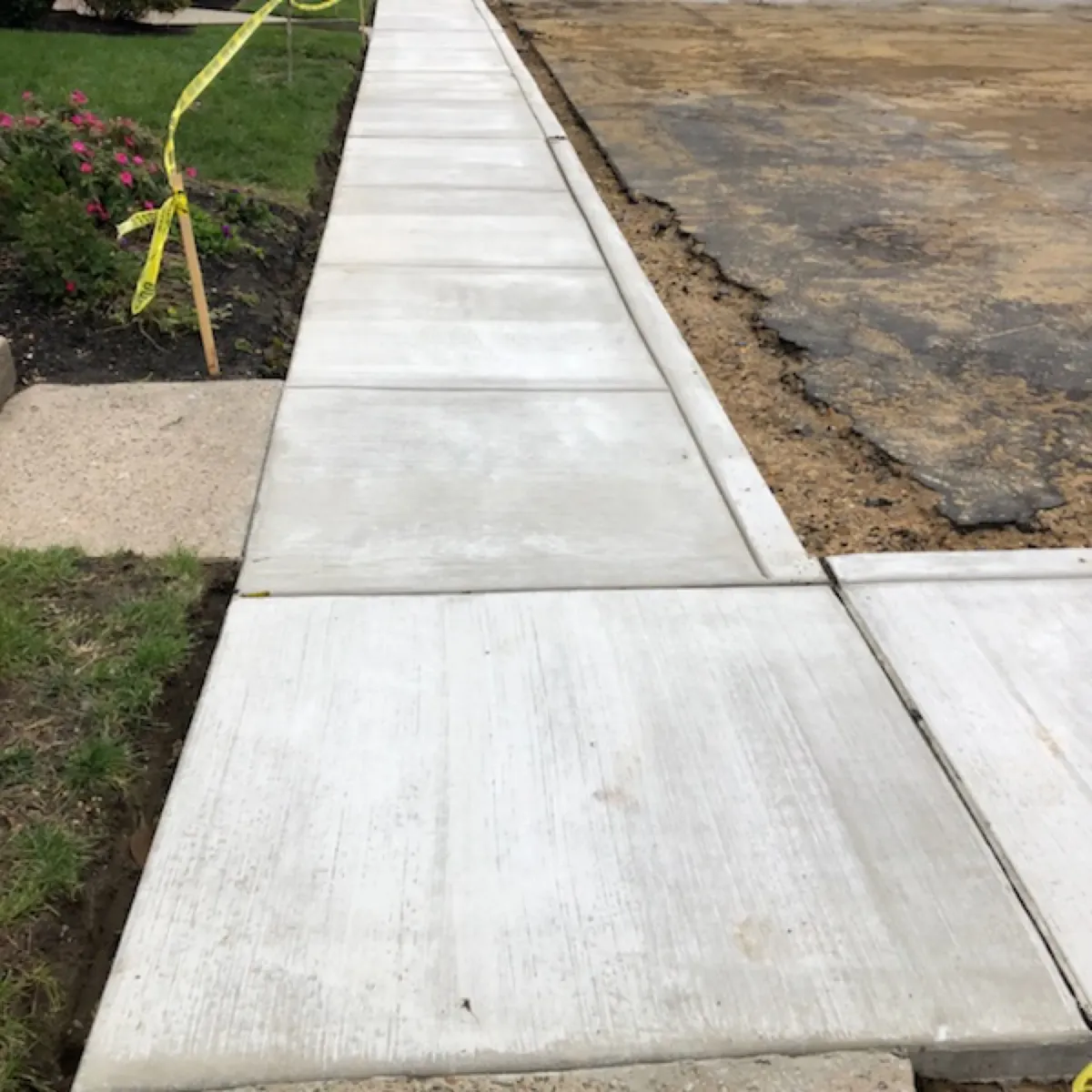 Jointed concrete sidewalk panels with a broom finish in Cherry Hill, NJ