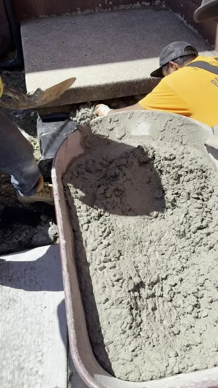 Placing fresh concrete by hand into a form in Cherry Hill, NJ
