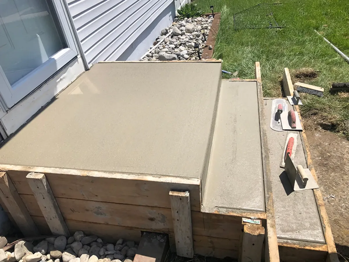 Freshly poured and troweled concrete stoop and steps in Cherry Hill, NJ