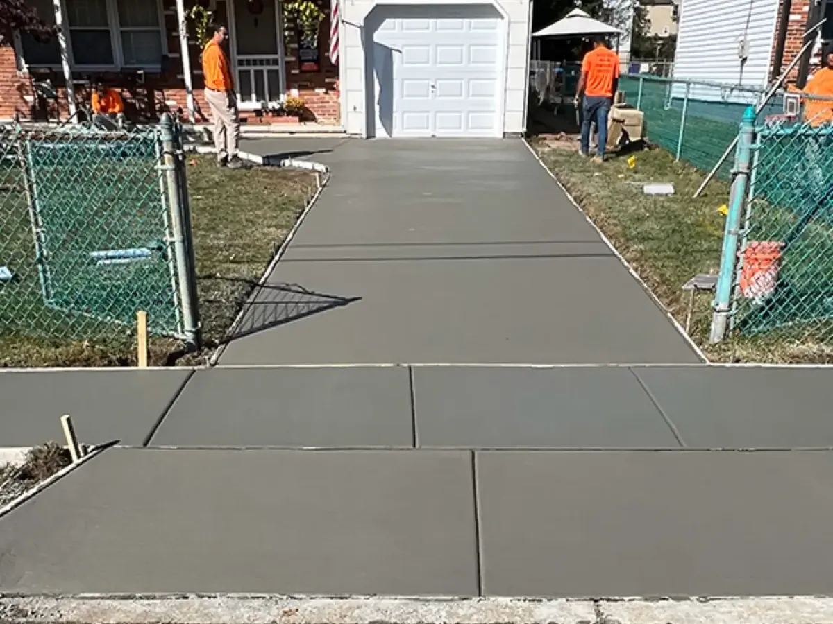 Freshly finished broom finish concrete driveway on a South Jersey home before any traffic
