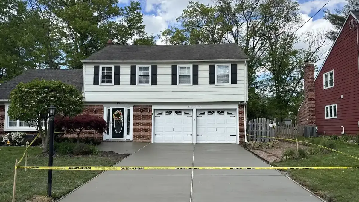 New concrete driveway taped off after the pour at a home in Cherry Hill NJ